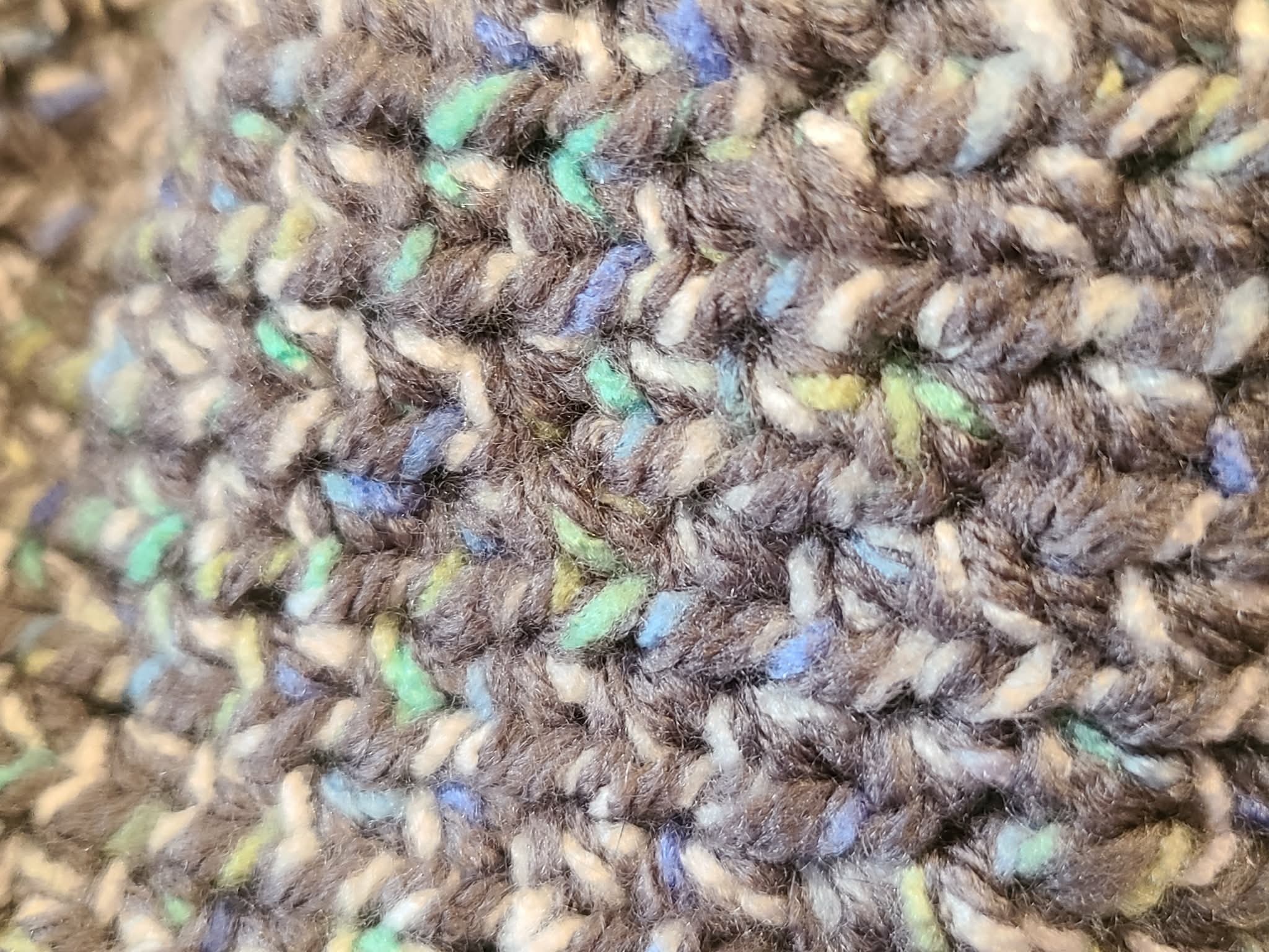 Close-up of textured fabric with multicolored yarn