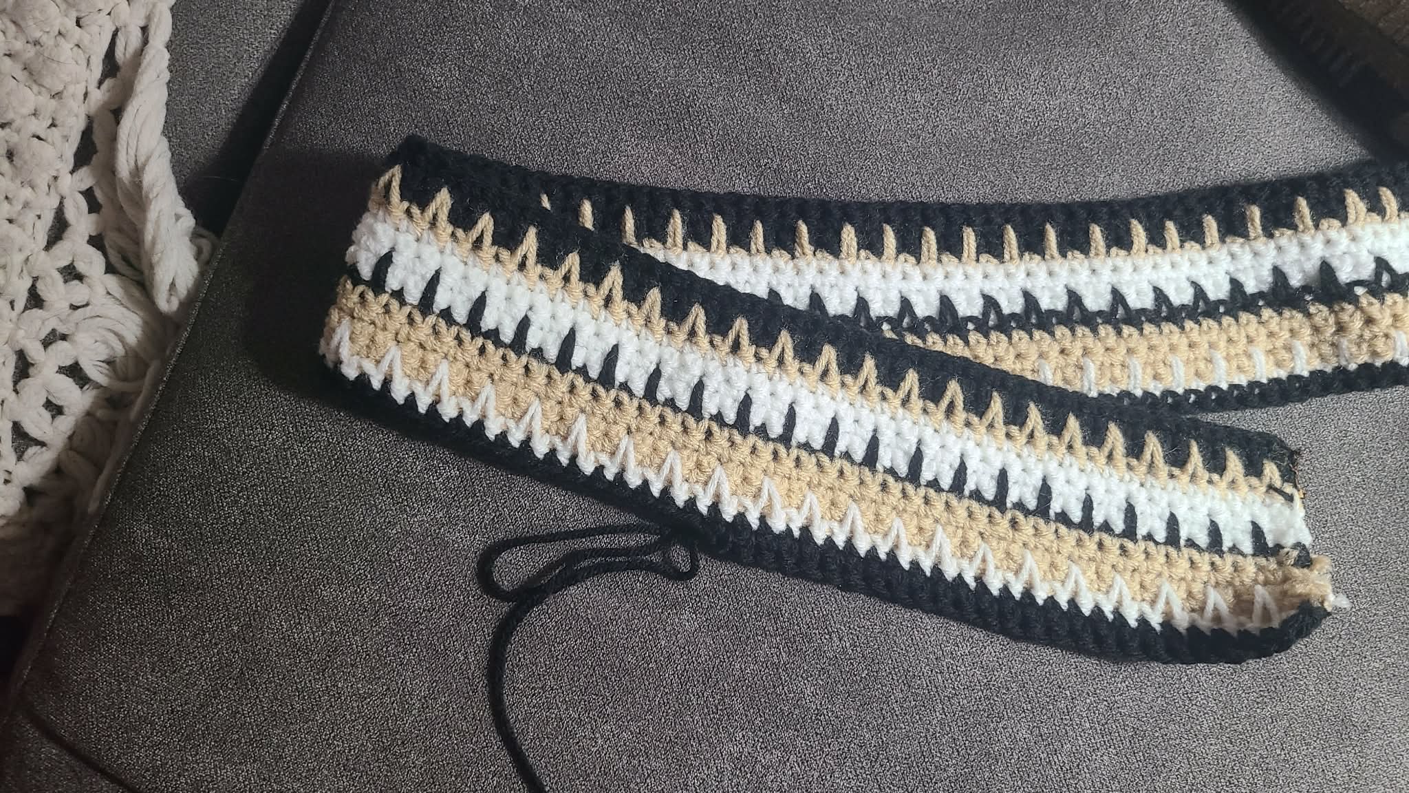 Two sides of crocheted strips, showing both sides, both a bit different naturally.